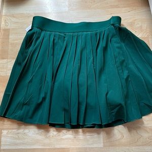 Green pleated TNA action tennis skirt